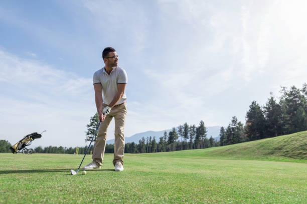 istock Golf player taking a tee shot on the golf course 1097302634
