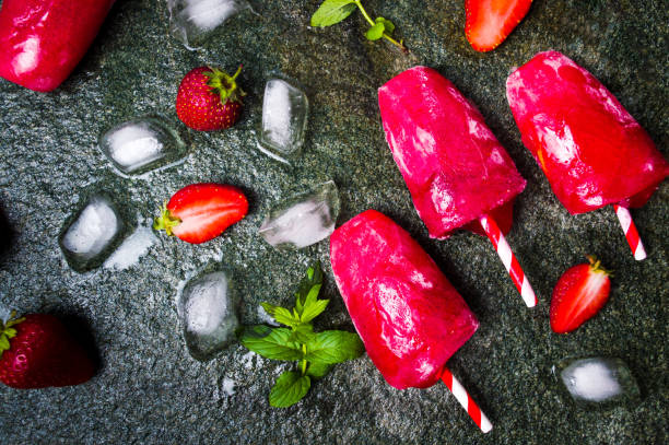 istock Strawberry popsicle dessert on dark background 1097308688