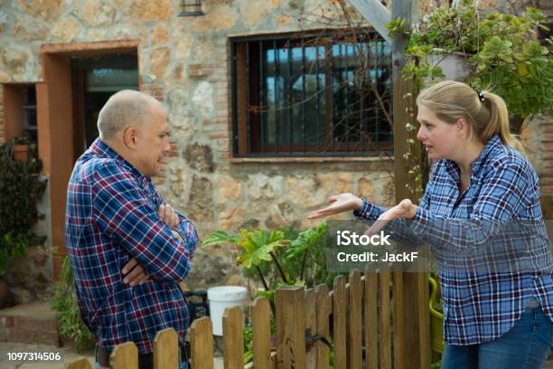 Woman Quarreling With Male Neighbor Stock Photo - Download Image Now - Neighbor, Arguing, Discussion