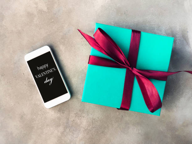 istock Gift Box and smartphone with Happy Valentine's Day 1097317574