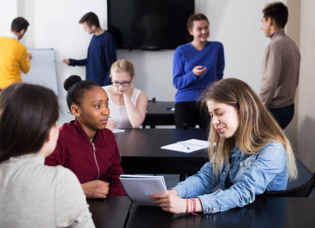 istock Girl consulting fellow student 1097318602