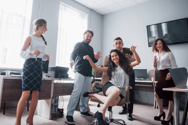 istock Happy young colleagues smile and have fun at the creative office. 1097318814