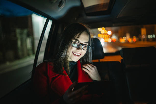 istock Beautiful young woman using smart phone in car 1097321864