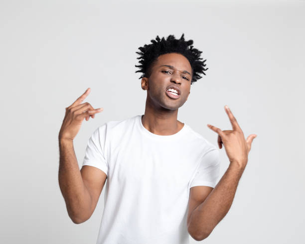 istock Funky afro american man with rock n roll hand sign 1097326126