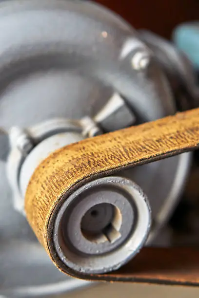 V-belt on white mechanism of an old pump