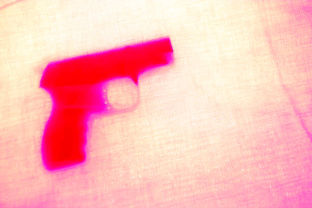 istock Revolver on pink background 1097329040