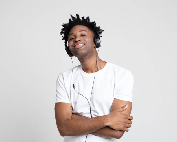 istock Stylish guy enjoying listening to music 1097329254
