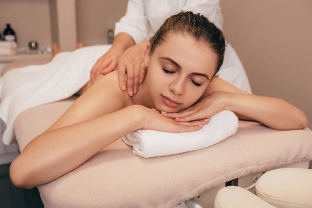 istock woman enjoying shoulder massage at spa salon 1097329506