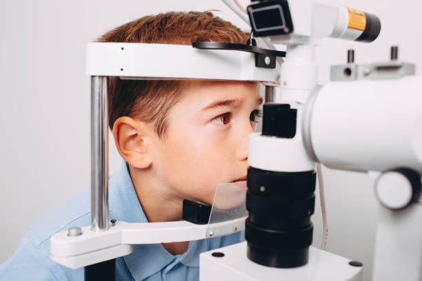istock Caucasian boy receiving eye exam at doctors office 1097329526