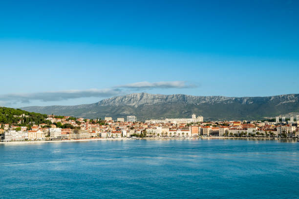 Panorama of the city of Split with a lighthouse in front seen from a cruise ship