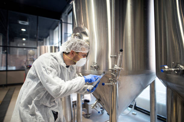 istock Professional technologist checking production in factory. Industrial worker with tablet in production plant. 1097331892