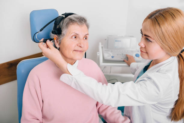 istock Senior patient having hearing exam with special headphones 1097334938