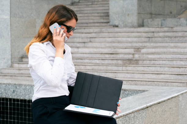 istock Businesswoman calling to colleague 1097336540
