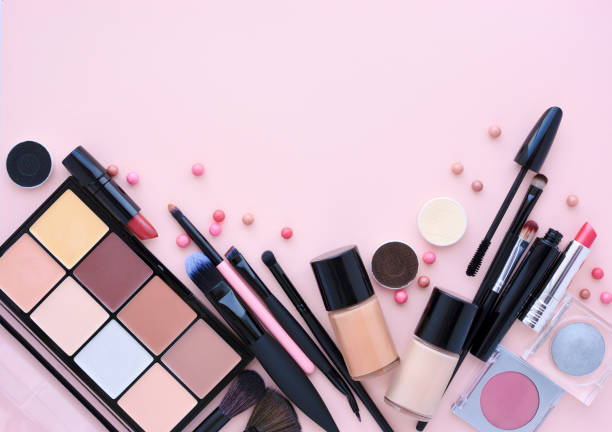 istock Makeup brush and decorative cosmetics on a pastel pink background with empty space. Top view 1097338932