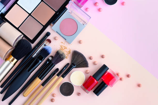 istock Makeup brush and decorative cosmetics on pink background with empty space. Top view 1097338974