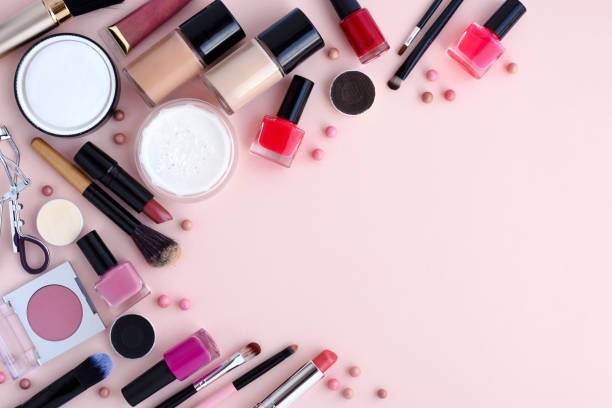 istock Makeup brush and decorative cosmetics on pink background with empty space. Top view 1097339006