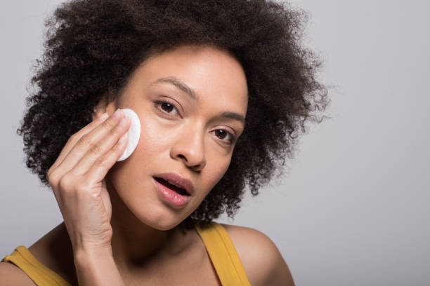 istock Woman cleaning her face 1097340628