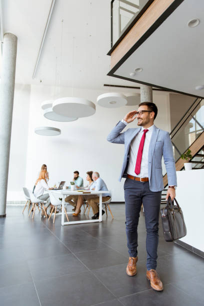istock Handsome businessman leaving office 1097342232