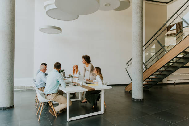 istock Joyful multiracial business team at work in modern office 1097342240