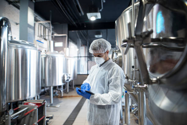 istock Professional technologist using tablet in production plant checking productivity and quality. 1097343012