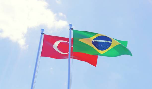istock Turkey and Brazil, two flags waving against blue sky 1097343370