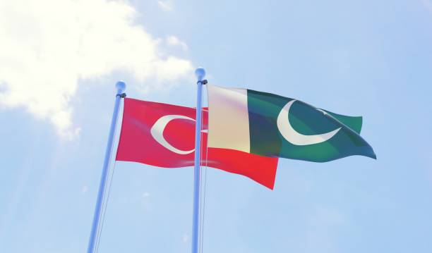 istock Turkey and Pakistan, two flags waving against blue sky 1097343838