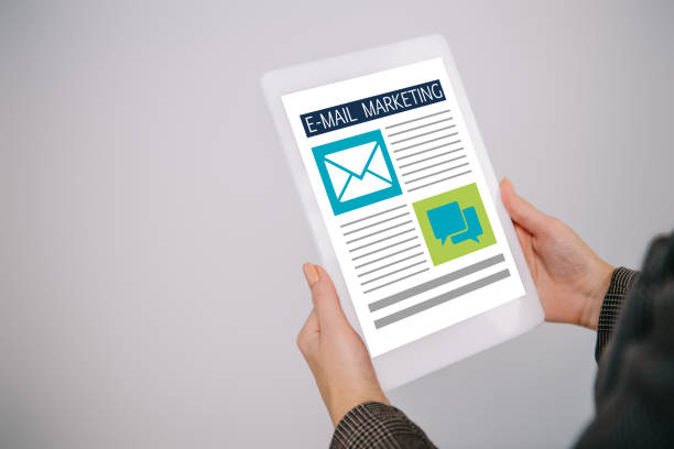 istock cropped view on businesswoman using digital tablet with e-mail marketing isolated on grey 1097346276
