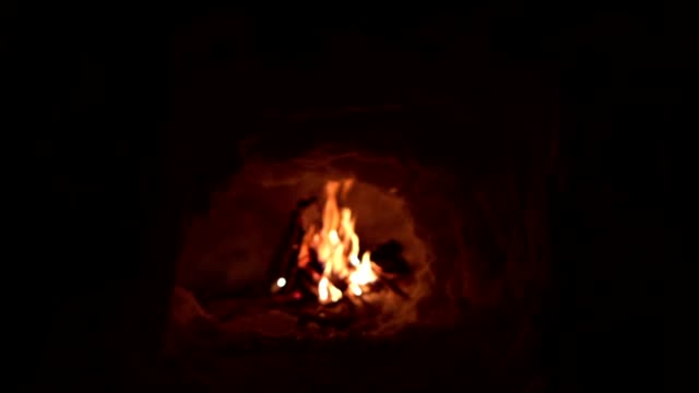 Igloo bonfire built by hikers stranded in the woods during winter