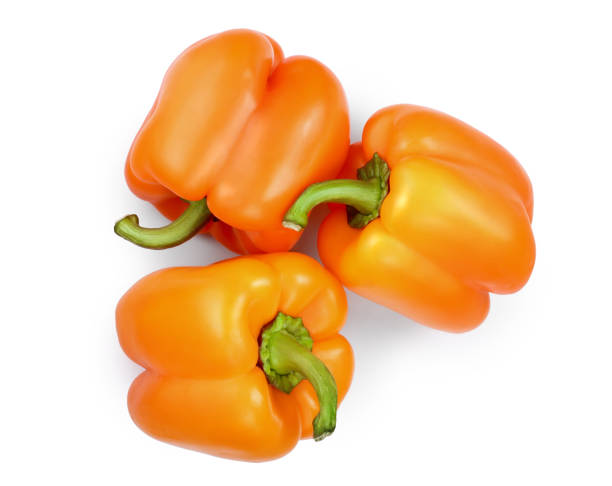 istock orange sweet bell pepper isolated on white background. Top view. Flat lay 1097350516