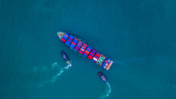 istock Container ship carrying container for import and export, business logistic and transportation by ship in open sea, Aerial view cargo container ship. 1097352834