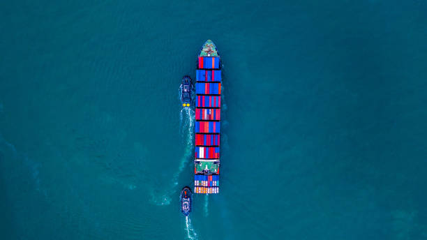 istock Container ship carrying container for import and export, business logistic and transportation by ship in open sea, Aerial view cargo container ship. 1097352840