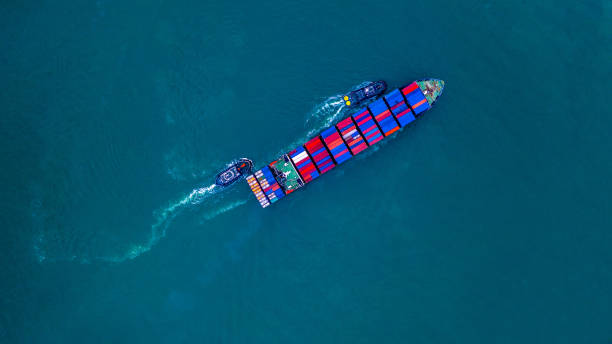 istock Container ship carrying container for import and export, business logistic and transportation by ship in open sea, Aerial view cargo container ship. 1097352844