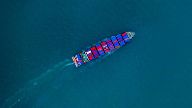 Container ship carrying container for import and export, business logistic and transportation by ship in open sea, Aerial view cargo container ship.