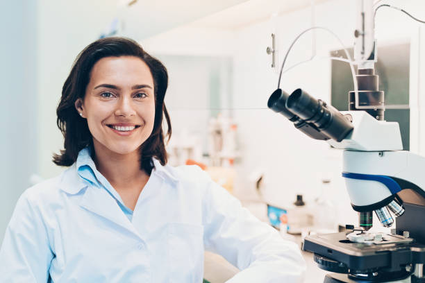 istock Smiling scientist in the laboratory 1097354036