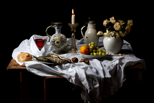 Classical Baroque Still-life in Dutch breakfast style on a black Background