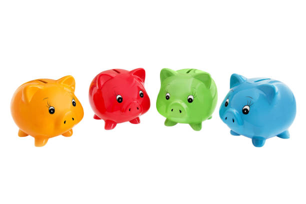 istock Four Piggy Banks against 1097357182