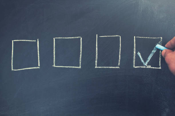 istock checked the box by symbol of tick on chalkboard 1097357808
