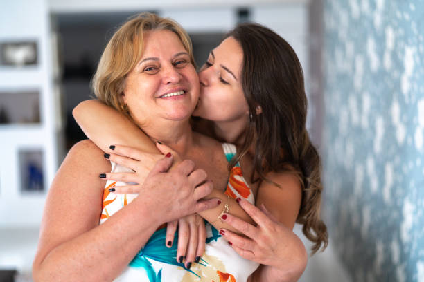 Daughter and Mother Embracing at Home
