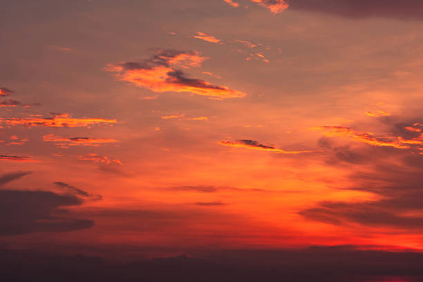 istock Dramatic red and orange sky and clouds abstract background. Red-orange clouds on sunset sky. Warm weather background. Art picture of sky at dusk. Sunset abstract background. Dusk and dawn concept 1097372516