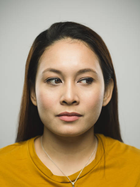 istock Real malaysian young woman with blank expression looking to the side 1097375250