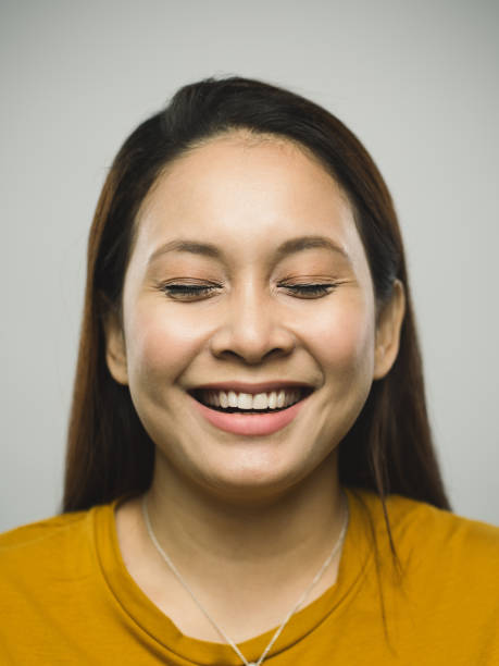 istock Real malaysian young woman with excited expression and eyes closed 1097375504