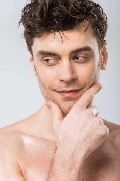 istock portrait of handsome pensive man isolated on grey 1097381172