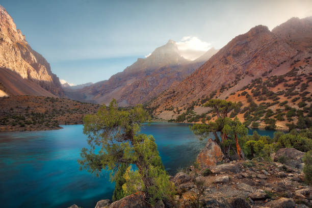 Alaudin Lake in the Fann Mountains, taken in Tajikistan in August 2018 taken in hdr Alaudin Lake in the Fann Mountains, taken in Tajikistan in August 2018 taken in hdr juniperus chinensis stock pictures, royalty-free photos & images