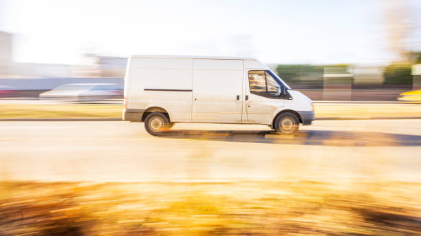 istock a fast-moving white minibus in the city.blurry effect 1097386130