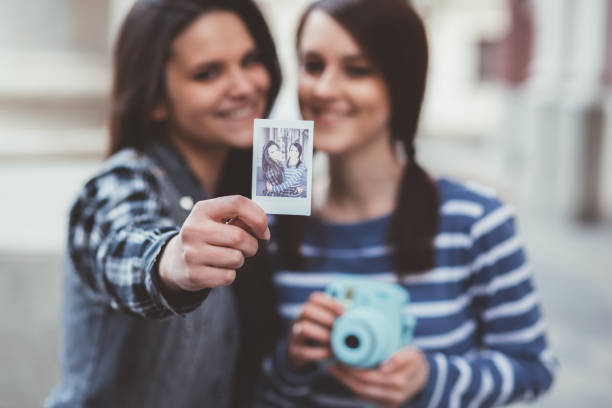 istock Girls taking photos outside 1097387494
