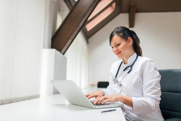 istock Female doctor working at office desk. 1097388696