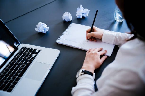 istock Young business woman writing down her ideas. 1097389848