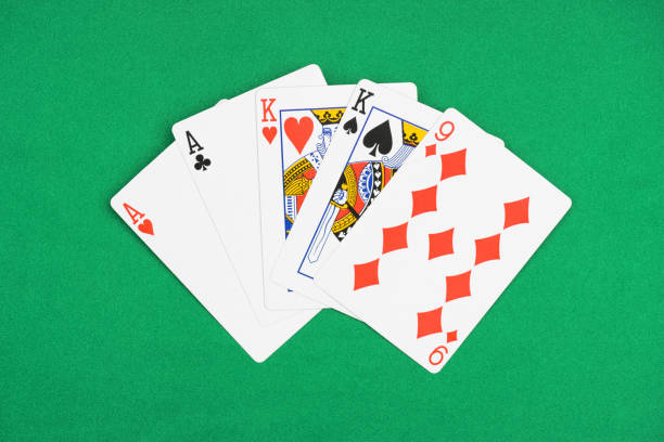 istock top view of green poker table with unfolded playing cards with different suits 1097396138