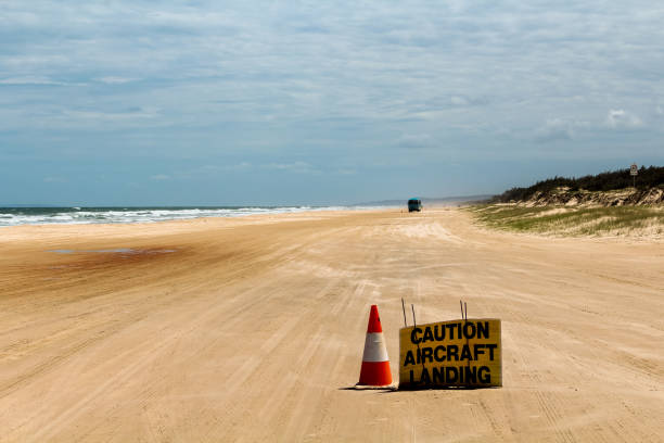 istock Provisional runway with warning sign at Seventy Five Mile Beach on Fraser Island (Queensland, Australia) 1097399160