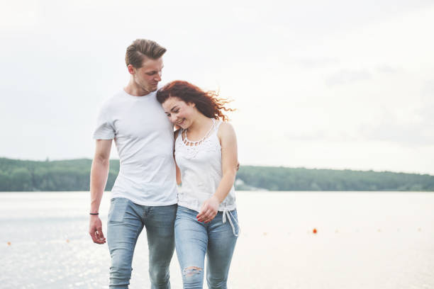 istock Happy young couple enjoying a solitary beach backriding 1097404020